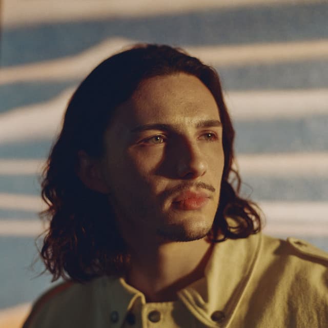Petit Biscuit artist profile image